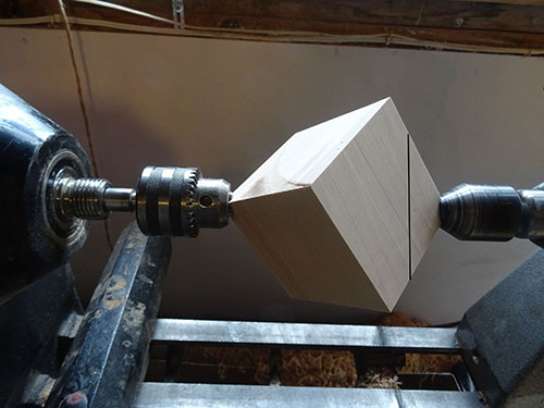 Setting cube between lathe centers