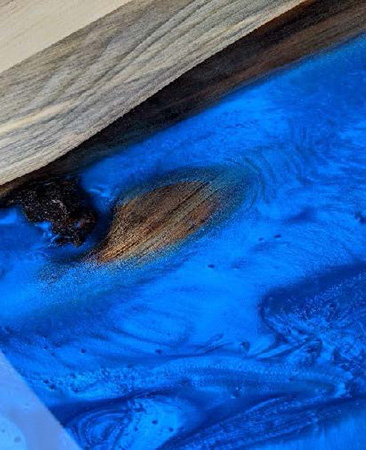 Close-up view of a timber cast epoxy pour