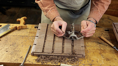 Trimming drawer installation grooves with hand plane