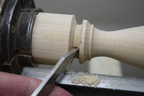 Marking toothpick holder base with parting tool