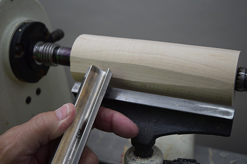 Shaping turning blank into cylinder