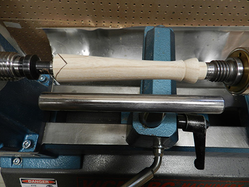 Turning lamp post blank on lathe