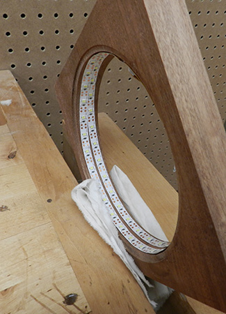 Wrapping LED strip around lamp frame interior