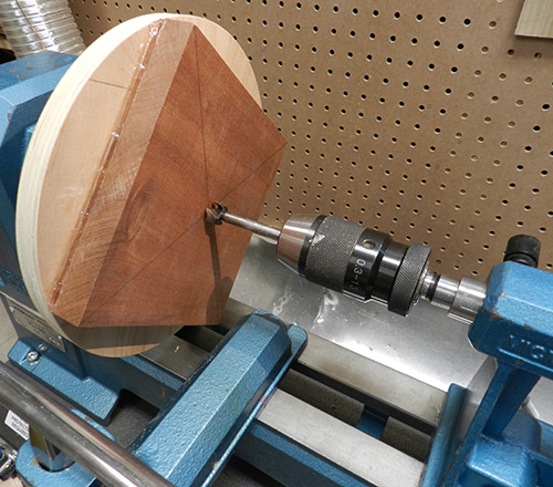 Mounting lamp base blank on lathe