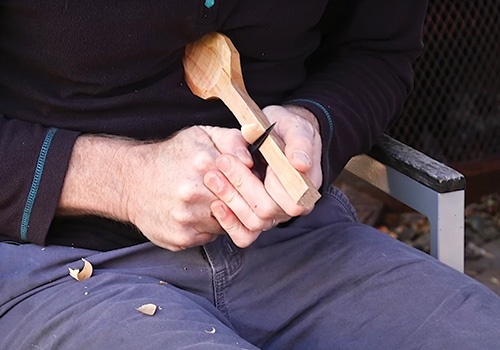 Finishing the carving of the spoon handle
