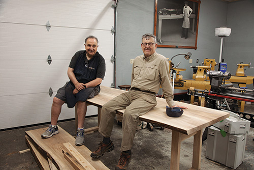 Ernie and Ken sitting on trestle table