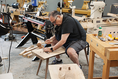 Cutting ends off wedged tenons in trestle table bench