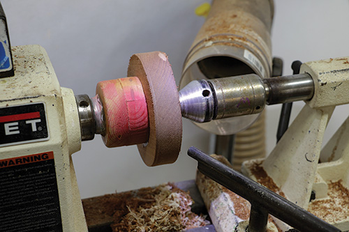 Mounting blank for wine caddy on lathe