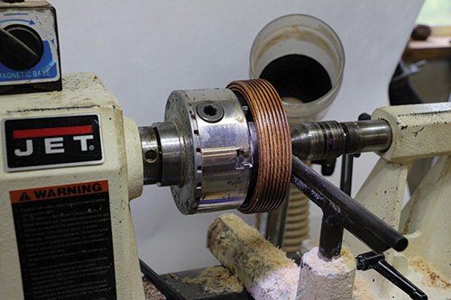 Using lathe chuck extension for easier access to wine caddy base
