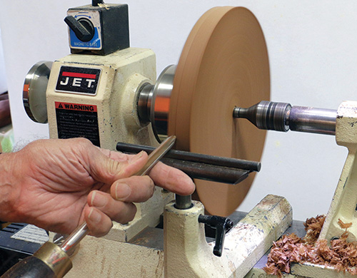 Truing rim of trivet on a lathe