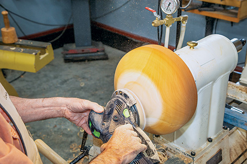 Sanding bottom of calabash bowl