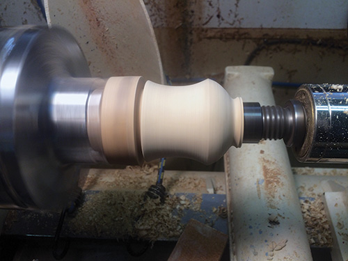 Stopper blank in the process of being turned