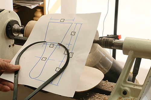 Using caliper to measure carving mallet handle