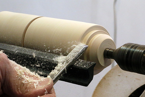 Making cuts on carving mallet with tool rest