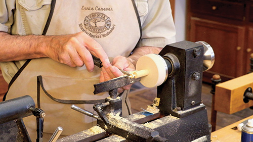 Scraping earring shape on a lathe