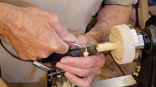 Fitting earring hardware into turning projects with a pliers