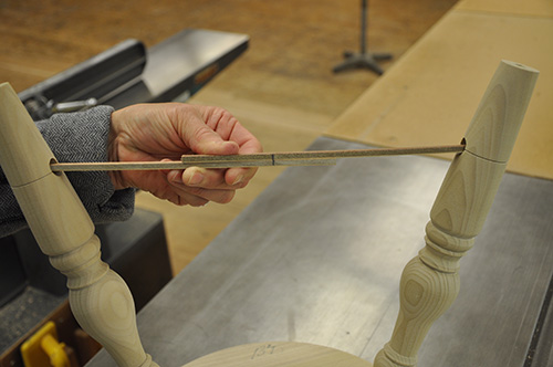 Measuring out length of stretcher with strips of wood