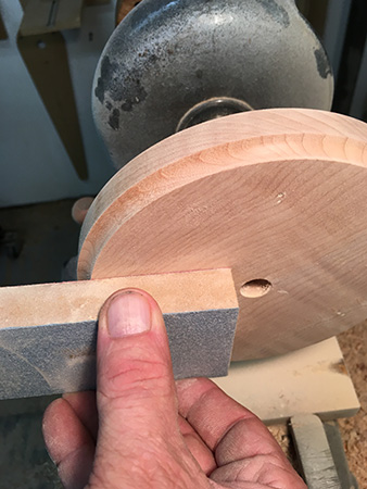 Flattening hourglass base blank with sanding block