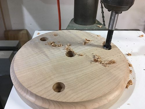 Drill three spindle holes in hourglass base