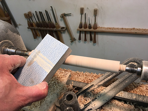 Final smoothing of spindle with sanding block