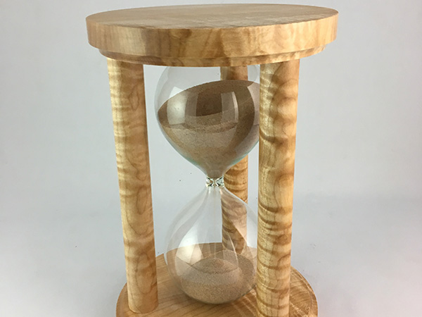 Hourglass cased in turned bases and spindles