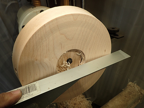 Checking shape of lamp base with straight edge