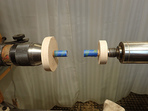 Wasteblocks mounted on lathe to set up tapering