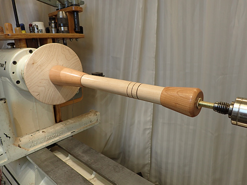 Gluing up lamp shaft parts assembled on lathe