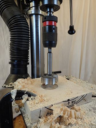Using drill press and Forstner bit to cut hole for lamp shaft base