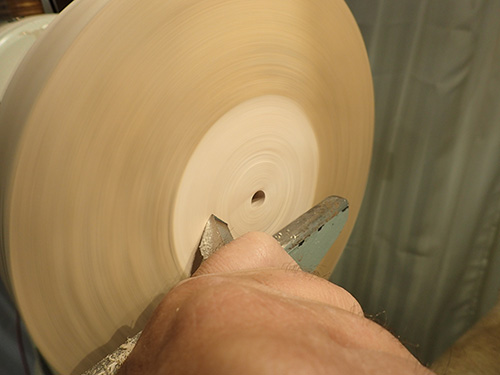 Turning recess in center of lamp base blank