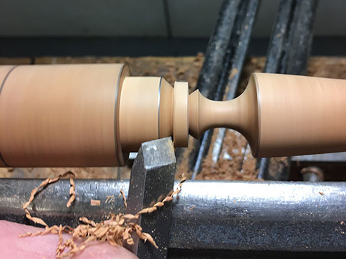 Turning centeral bead between knife and handle