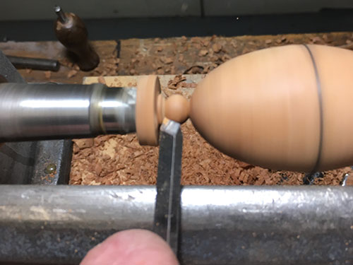 Creating decorative beading on base of handle