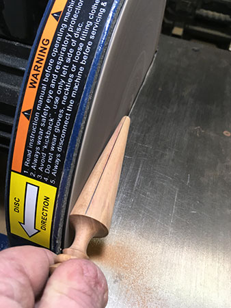 Using disc sander to being to flatten blade blank