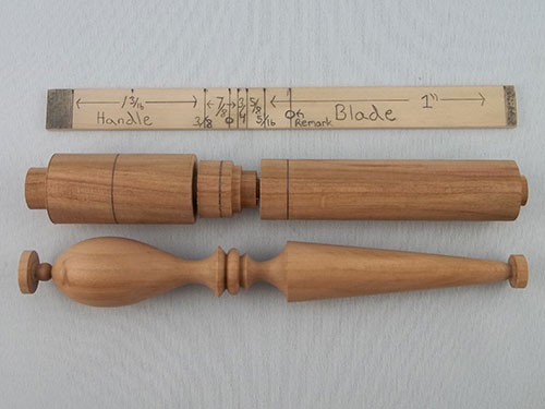 Different stages of letter opener turning laid out next to story stick
