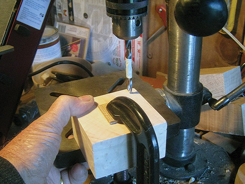 Drilling hole for magnetic box hinge at drill press