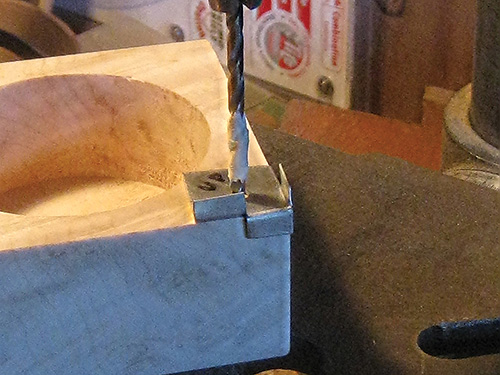 Using drilling jig to install magnetic catch in box base