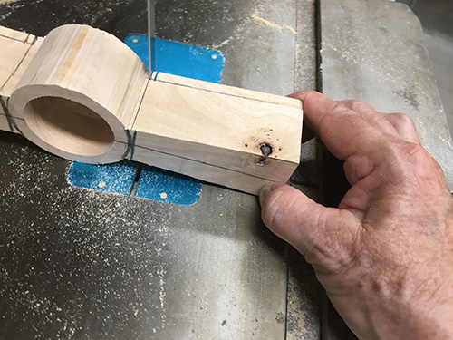 Cutting waste from tea strainer with band saw