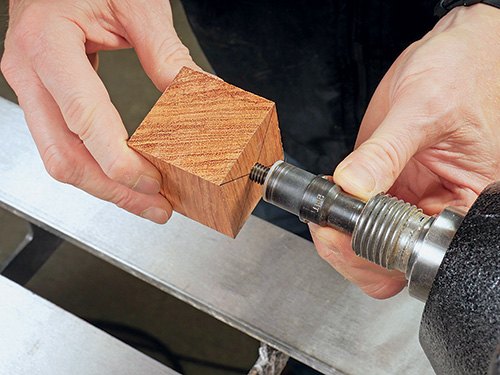 Mounting bottle stopper blank on lathe