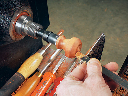 Shaping interior of top of bottle stopper