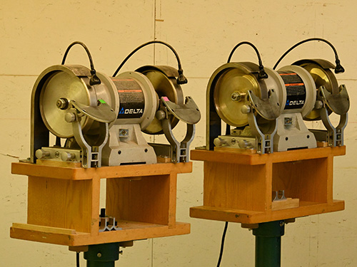 Pair of tool sharpeners on stands