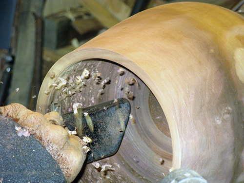 Carving interior of Hawaiian bowl