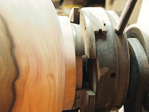Close-up of Hawaiian bowl mounted to lathe tailstock