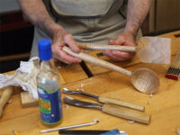 Displaying a turned and finished serving spoon and spatula