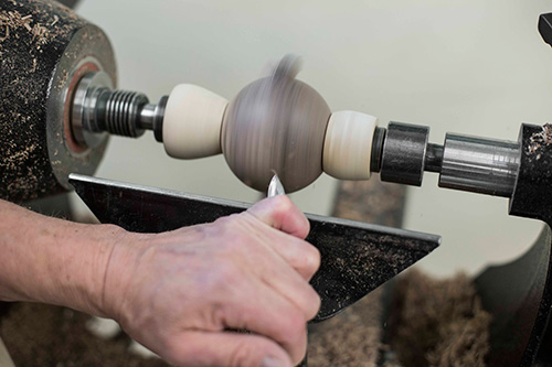 Finishing out rounding a sphere with a gouge on a tool rest