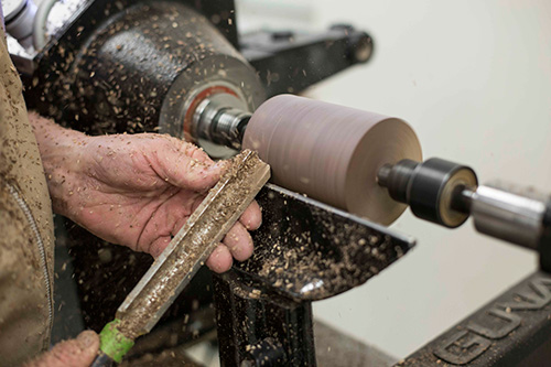 Removing flat surfaces from a turning blank