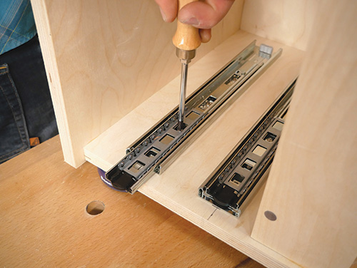 Installing centerline drawer slides in tool chest carcass