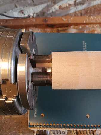 Mounting umbrella ornament base blank in lathe