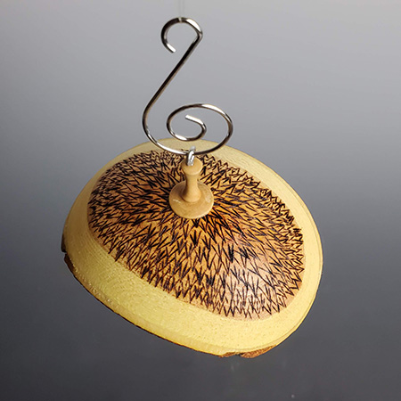 Decorative elements on umbrella ornament top