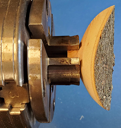 Mounting umbrella ornament top in four-jaw chuck