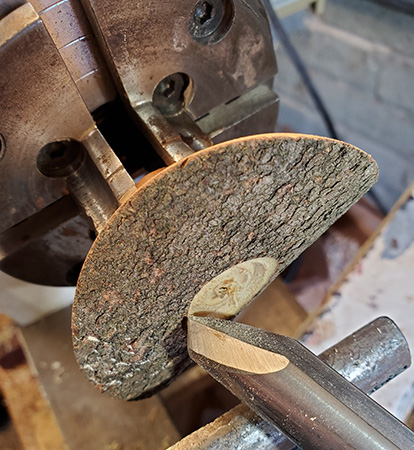 Beginning turning cuts on umbrella ornament top